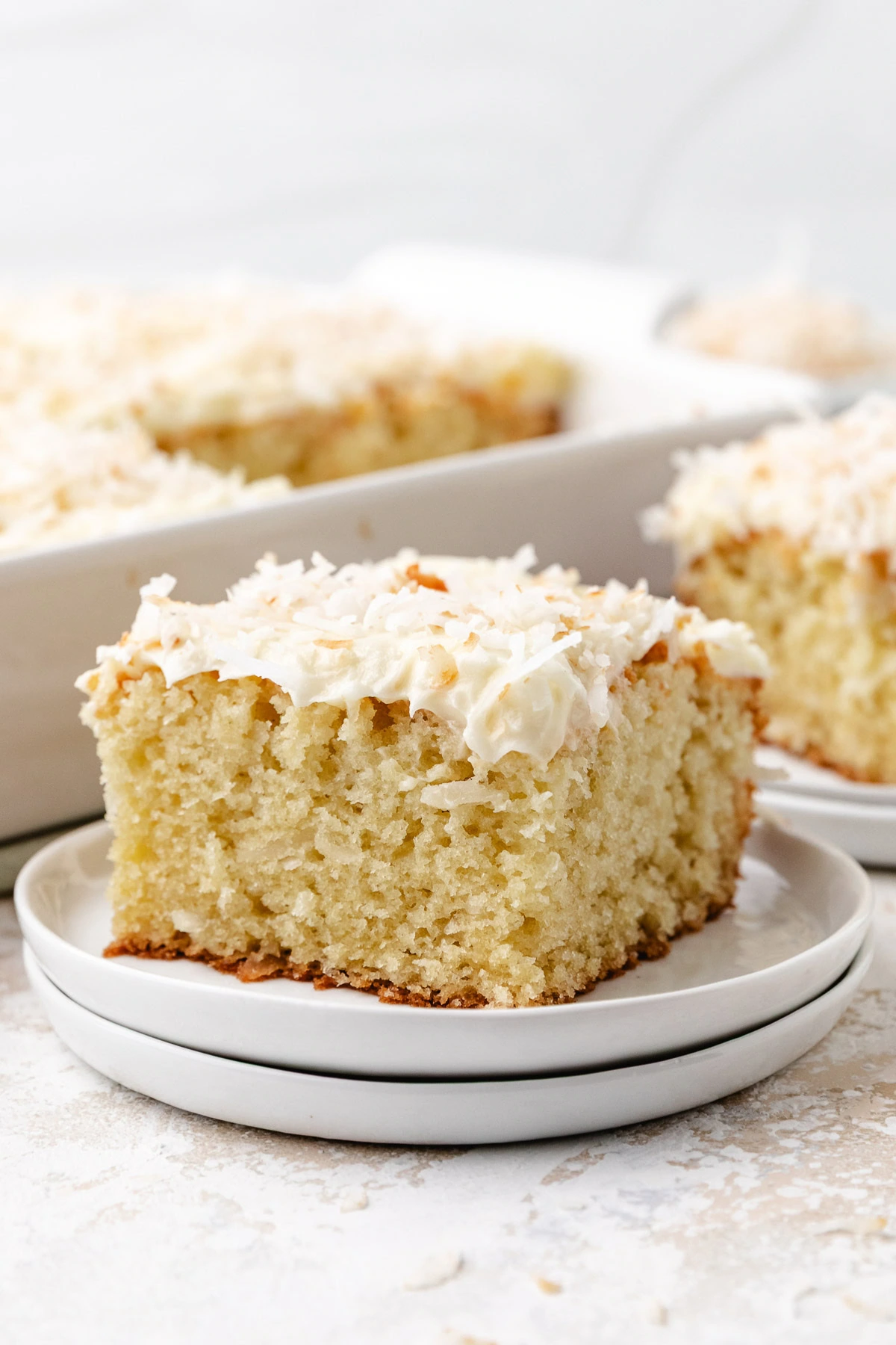 Frosted cake slice served from the baking dish.