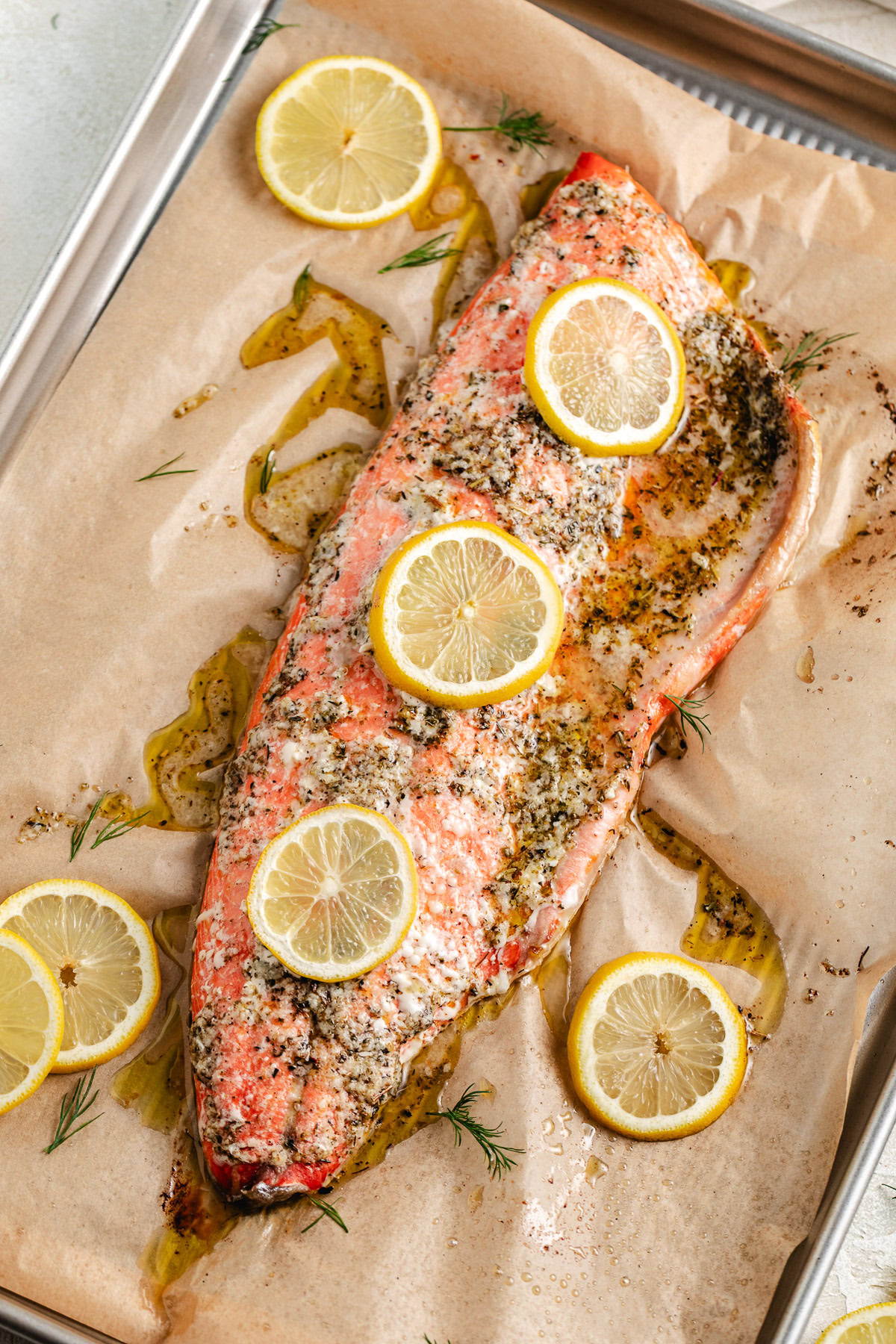 Overhead view of whole salmon fillet on parchment.